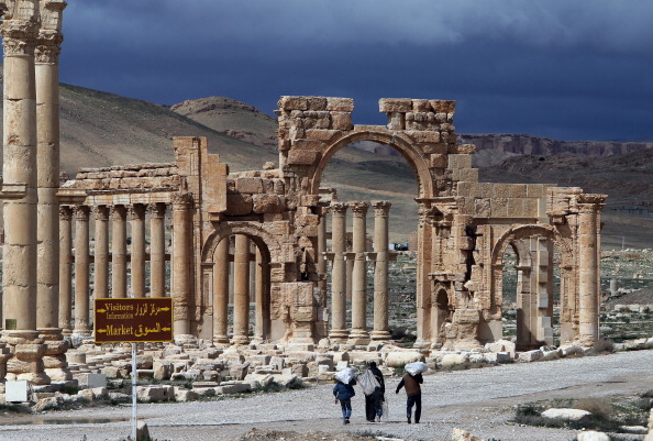  Syrian citizens walking in the ancient city of Palmyra. (AFP Photo: Joseph Eid/AFP/Getty Images)