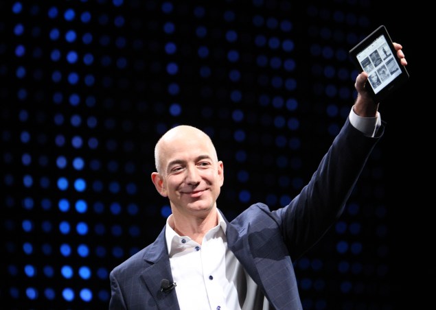 SANTA MONICA, CA - SEPTEMBER 6: Amazon CEO Jeff Bezos holds a new front-lit Kindle Paperwhite 3G reading device during a press conference on September 6, 2012 in Santa Monica, California. Amazon unveilved the Kindle Paperwhite and the Kindle Fire HD in 7 and 8.9-inch sizes. (Photo by David McNew/Getty Images)