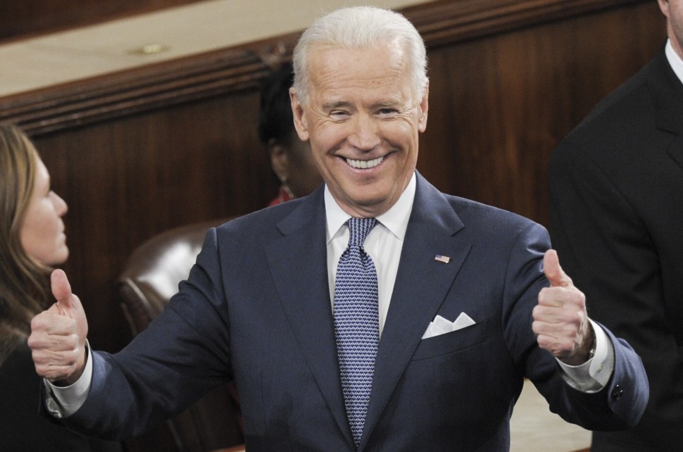 US Vice President Joe Biden gives two thumbs-up prior to US President Barack Obama delivering the State of the Union address before a joint session of Congress on January 28, 2014 at the US Capitol in Washington.  AFP PHOTO/Saul LOEB        (Photo credit should read SAUL LOEB/AFP/Getty Images)