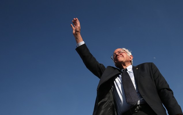 BURLINGTON, VT - MAY 26:  U.S. Sen. Bernie Sanders (I-VT) waves to supporters after officially announcing his candidacy for the U.S. presidency during an event at Waterfront Park May 26, 2015 in Burlington, Vermont. Sanders will run as a Democrat in the presidential election and is former Secretary of State Hillary ClintonÕs first challenger for the Democratic nomination.  (Photo by Win McNamee/Getty Images)