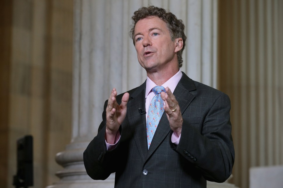 WASHINGTON, DC - JUNE 01:  U.S. Sen. Rand Paul (R-KY) does a live interview with FOX News in the Russell Senate Office Building rotunda on Capitol Hill June 1, 2015 in Washington, DC. In protest of the National Security Agency's sweeping program to collect U.S. citizens' telephone metadata, Paul blocked an extension of some parts of the USA PATRIOT Act, allowing them to lapse at 12:01 a.m. Monday. The Senate will continue to work to restore the lapsed authorities by amending a House version of the bill and getting it to President Obama later this week.  (Photo by Chip Somodevilla/Getty Images)