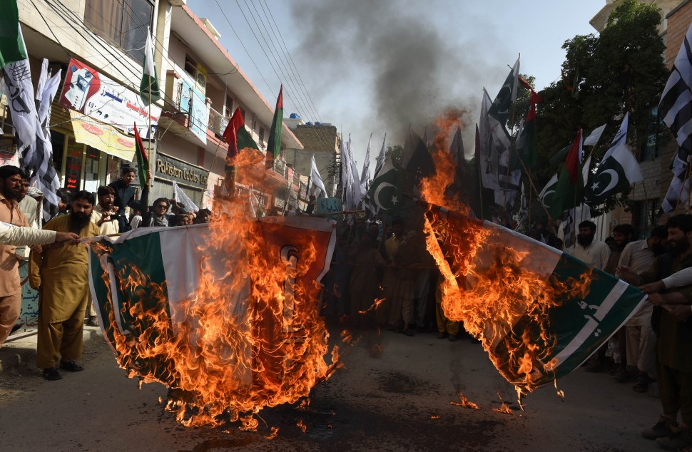 Pakistani activists from the banned organisation Jamaat-ud-Dawa (JuD) burn an Indian flag during a protest in Quetta on June 12, 2015. Pakistan has strongly reacted to comments made by Indian Prime Minister Narendra Modi that reportedly acknowledged Indian troops had a role in the war that created Bangladesh which was part of Pakistan until 1971 when separtisits won independence after a war. Pakistani parliament on June 11, 2015, passed unanimous resolutions strongly condemning recent provocative statements made by Indian leaders, including the threat of attacks against Pakistani territory. AFP PHOTO / BANARAS KHAN (Photo credit should read BANARAS KHAN/AFP/Getty Images)