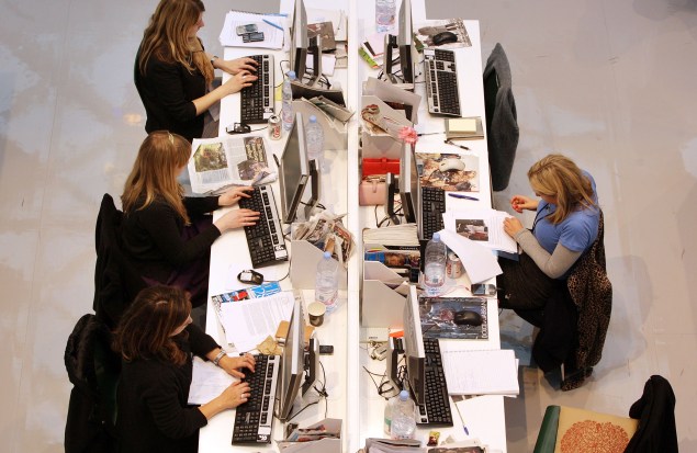 Production staff on the weekly fashion magazine, Grazia edit the magazine in a temporary office inside the Westfield shopping centre on November 3, 2008 in London. (Photo: Oli Scarff/Getty Images)