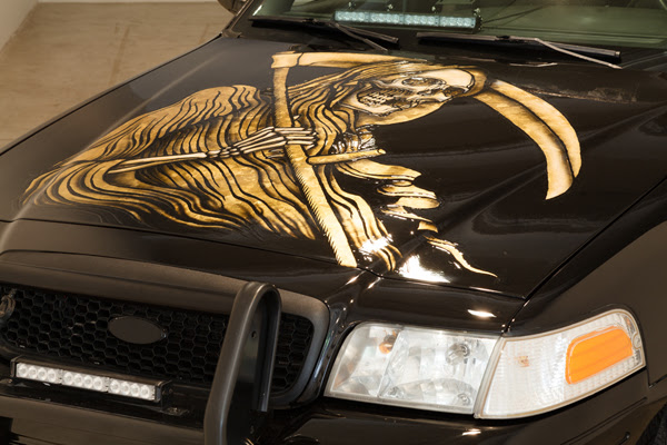 A custom Crown Vic by Scott Campbell. Photo: Courtesy of Martos Gallery