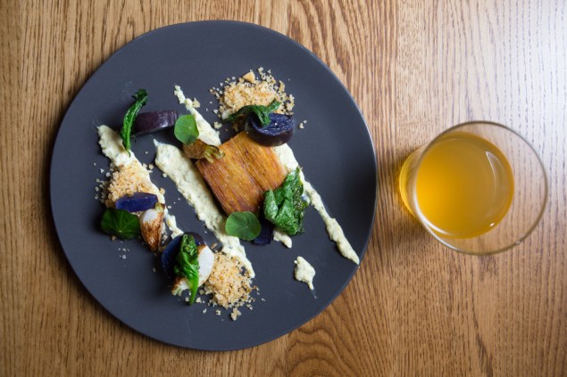 Layered potatoes with turnips, mustard greens and gribiche, paired with Shacksbury Basque at Wassail. (Photo: Arman Dzidzovic/New York Observer)