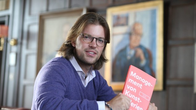 Mangus Resch and the German version of his book, Management of art Galleries. (Photo: courtesy of Frank Senftleben)