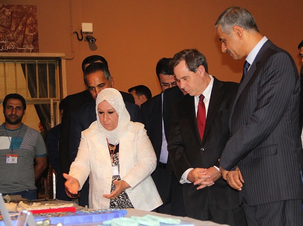 BAGHDAD, IRAQ - JULY 15: Iraqi Minister of Tourism and Antiquities Adel Fahad Shershab (R) and US Ambassador to Iraq Stuart Jones (2nd R) listen to an museum official on the historical artifacts those returned to Iraq National Museum in Baghdad, Iraq on July 15, 2015. (Photo by Haydar Hadi/Anadolu Agency/Getty Images)