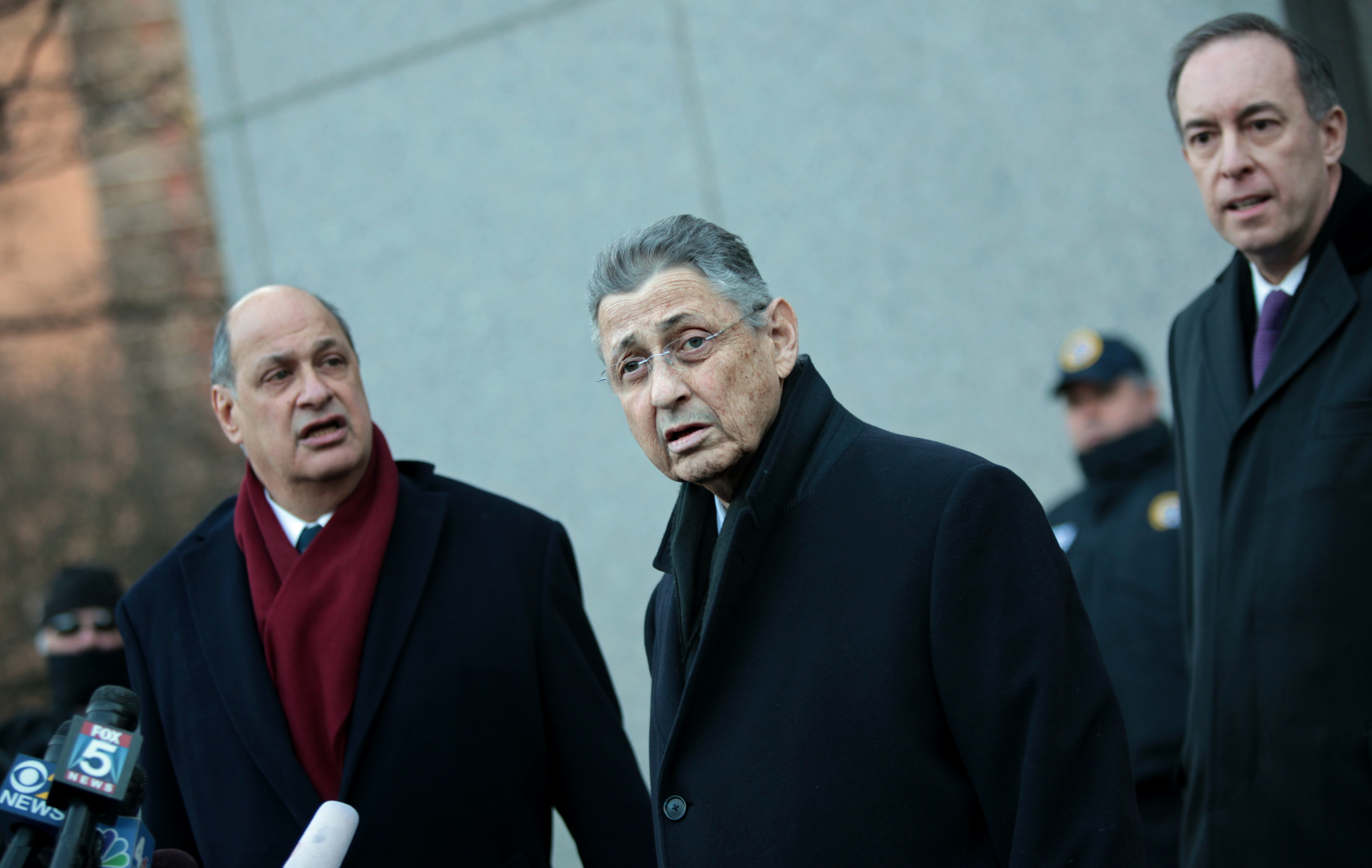 New York State Assembly Speaker Sheldon Silver walks out of the Federal Courthouse with his lawyers on January 22. (Photo by Yana Paskova/Getty Images)