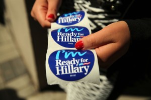 NEW YORK, NY - APRIL 11:  Stickers are handed out to supporters of Hillary Rodham Clinton's yet to be announced presidential campaign at a rally in Manhattan on April 11, 2015 in New York City. It is expected that Clinton will end months of speculation and launch her anticipated 2016 presidential campaign on Sunday with an announcement on social media. Following that it is believed that candidate Clinton will travel to Iowa and New Hampshire, seeking to connect directly with voters in more intimate settings.  (Photo by Spencer Platt/Getty Images)