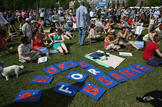 BURLINGTON, VT - MAY 26:  Supporters of Democratic presidential candidate U.S. Sen. Bernie Sanders (I-VT) gather  to watch him officially announce his candidacy for the U.S. presidency during an event at Waterfront Park May 26, 2015 in Burlington, Vermont. Sanders will run as a Democrat in the presidential election and is former Secretary of State Hillary Clinton's first challenger for the Democratic nomination.  (Photo by Win McNamee/Getty Images)