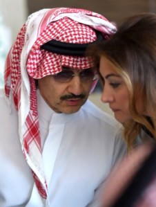 Saudi Arabia's billionaire Prince Alwaleed bin Talal (L) speaks with his media advisor Heba Fatani during a press conference in the Saudi capital, Riyadh, on July 1, 2015. Alwaleed pledged his entire $32-billion (28.8-billion-euro) fortune to charitable projects over the coming years. The prince said in a statement that the "philanthropic pledge will help build bridges to foster cultural understanding, develop communities, empower women, enable youth, provide vital disaster relief and create a more tolerant and accepting world." AFP PHOTO / FAYEZ NURELDINE (Photo credit should read FAYEZ NURELDINE/AFP/Getty Images)