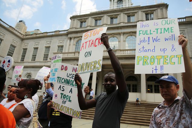 Taxi drivers and progressive groups protest Uber at City Hall this week. (Photo: Spencer Platt/Getty Images)