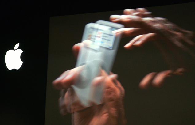 A giant screen shows a video presenting the miniaturized iPod called the "nano", (Photo: JOEL SAGET/AFP/Getty Images)