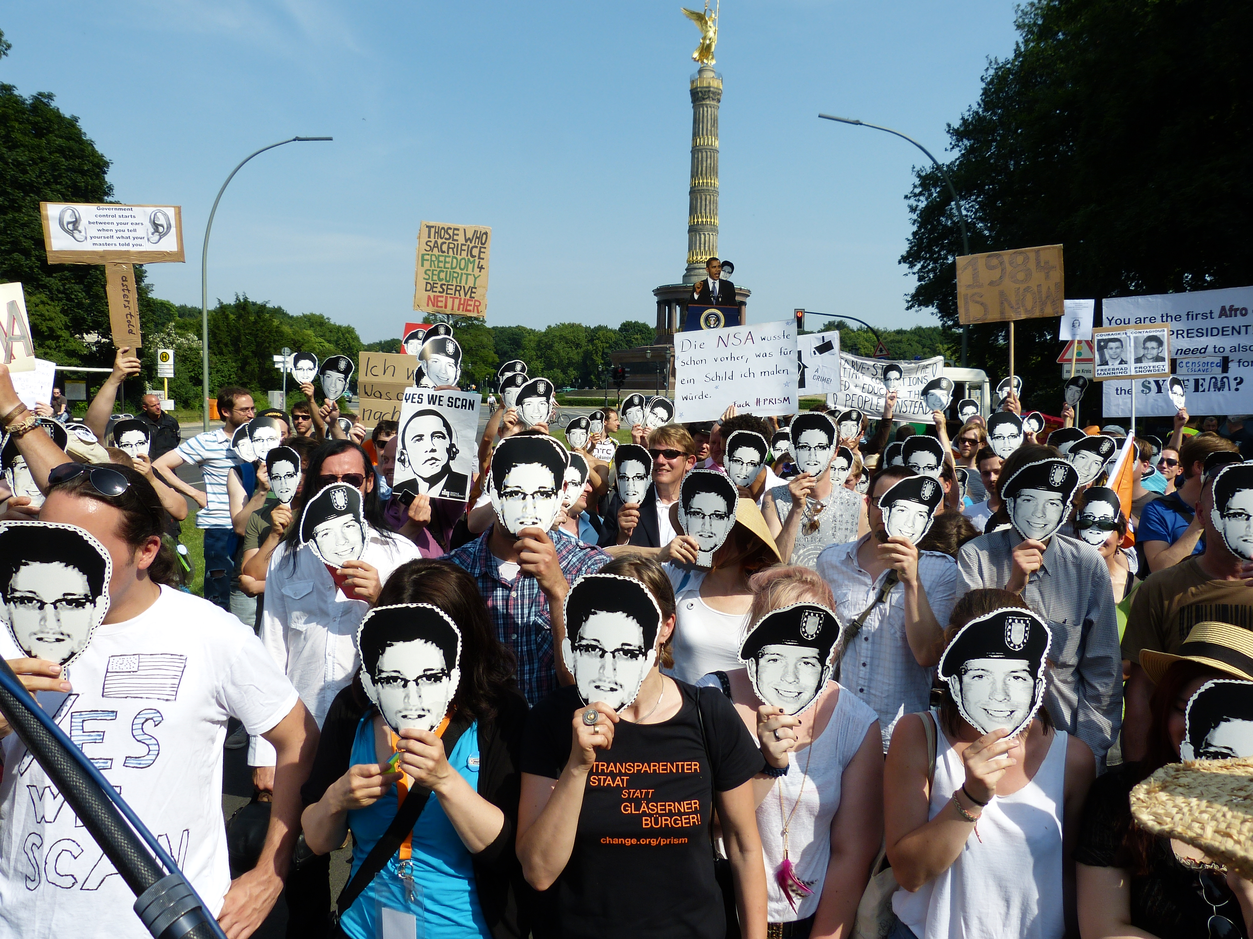 Protesters in Berlin wearing Chelsea Manning and Edward Snowden masks. (Photo: Wikipedia)