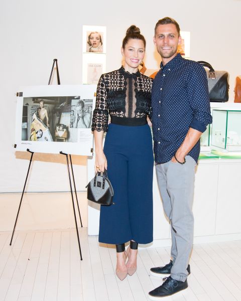 Jessica Biel and brother Justin pose next to one of the photos from the #BareItAll campaign. (Photo: BFA)