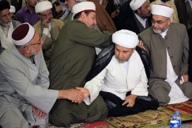 Sunnis and Shiites perform an unified Friday prayer in Baghdad. (ALI AL-SAADI/AFP/Getty Images)