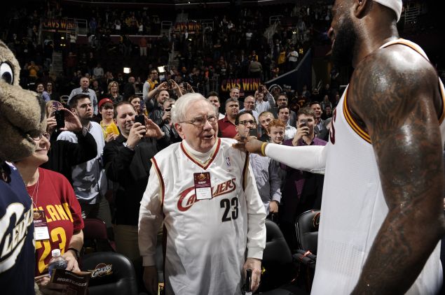 CLEVELAND, OH - DECEMBER 15: Warren Buffett and LeBron James #23 of the Cleveland Cavaliers talk after the game against the Charlotte Hornets on December 15, 2014 at Quicken Loans Arena in Cleveland, Ohio. NOTE TO USER: User expressly acknowledges and agrees that, by downloading and/or using this Photograph, user is consenting to the terms and conditions of the Getty Images License Agreement. Mandatory Copyright Notice: Copyright 2014 NBAE (Photo by David Liam Kyle/NBAE via Getty Images)