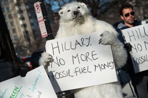 Environmental activists protest against the proposed Keystone XL pipeline in front of the Center for Strategic and International Studies (SCIS) where former US Secretary of State Hillary Clinton is to speak at Syracuse Universitys S.I. Newhouse School of Public Communications presentation of the Toner Prize for Excellence in Political Reporting in Washington, DC, on March 23, 2015. AFP PHOTO/NICHOLAS KAMM (Photo credit should read NICHOLAS KAMM/AFP/Getty Images)