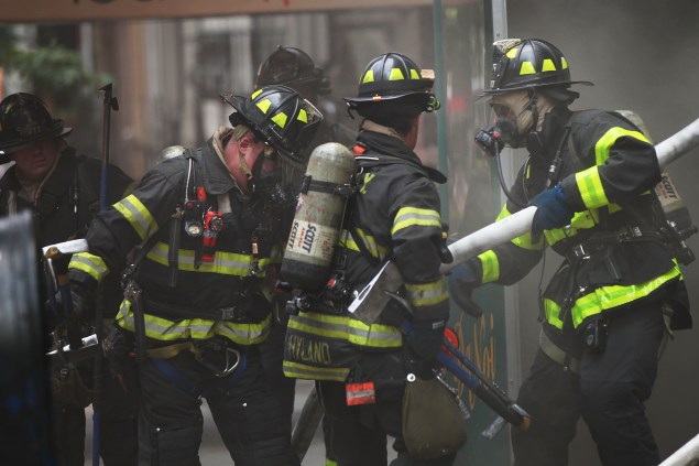 Firefighters put out a fire in Manhattan. (Photo: Spencer Platt/Getty Images)