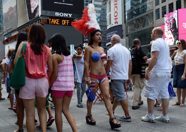 A topless woman in Times Square. (Photo: AFP PHOTO/DON EMMERT (Photo credit should read DON EMMERT/AFP/Getty Images)
