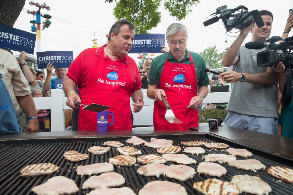 DES MOINES, IA - AUGUST 22: Republican presidential candidate New Jersey Governor Chris Christie (L) and Iowa Governor Terry Branstad help to cook pork at the Iowa Pork Producers Tent at the Iowa State Fair on August 22, 2015 in Des Moines, Iowa. Presidential candidates have a long tradition of making campaign stops at the fair. (Photo by Scott Olson/Getty Images)
