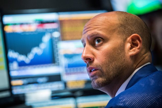 A trader works on the floor of the New York Stock Exchange during Wednesday's 620 point rally (Photo: Andrew Burton for Getty Images)
