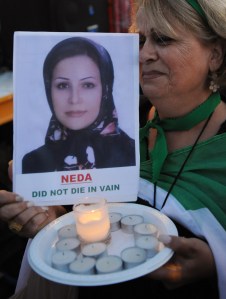 An Iranian woman holds up a picture of the slain Iranian protester named Neda Soltani  (MARK RALSTON/AFP/Getty Images)