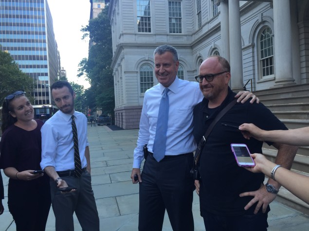 Bill de Blasio and Louis CK stop for a picture outside City Hall. (Photo: Jillian Jorgensen for Observer)