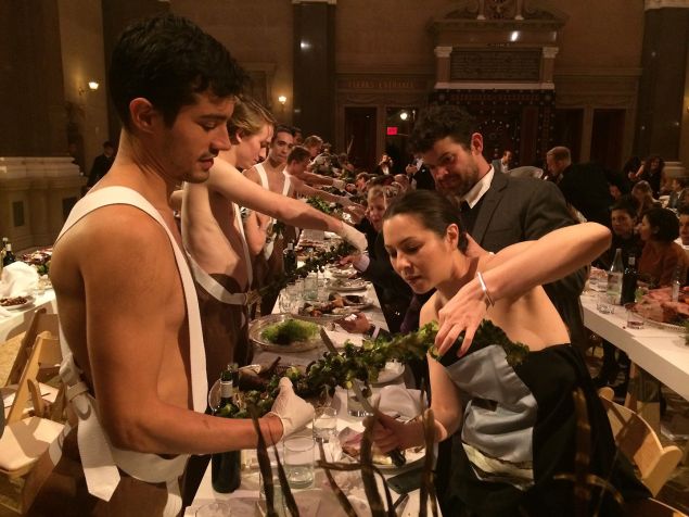 A guest at Performa's 2014 Gala carefully cuts brussell sprouts. (Photo: Performa)