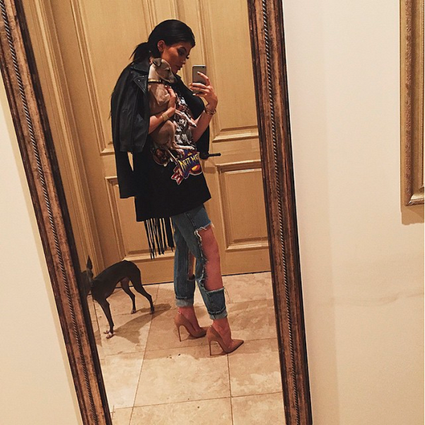 Ms. Jenner posing with her dogs, Norm and Bambi. (Photo: Instagram/Kylie Jenner)