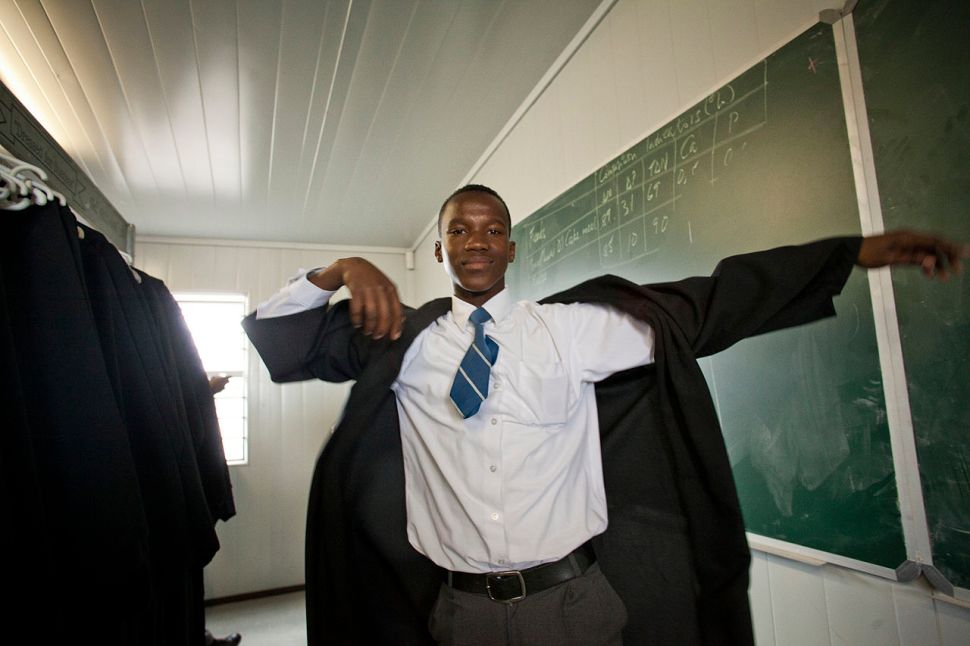 Wikipedia editor and high school student Ntsika Kellem on graduation day, near Cape Town, South Africa. (Photo: Sydellewillowsmith / WikiCommons)