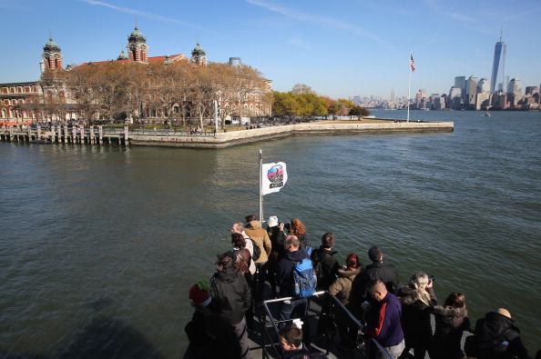 A boat carrying tourists arrives at Ellis Island after it was re-opened to the public on October 28, 2013 in New York City. (Photo: John Moore/Getty Images)