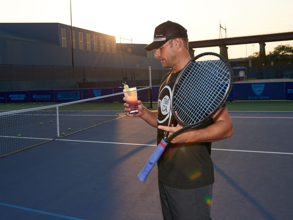 Andy Roddick enjoys an on-court cocktail (Photo: Grey Goose).
