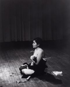 Cut Piece (1964) performed by Yoko Ono in New Works of Yoko Ono, Carnegie Recital Hall, New York, March 21, 1965. (Photo: by Minoru Niizuma, Courtesy of Lenono Photo Archive, New York)