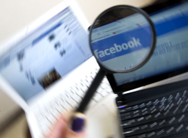 Picture of a magnifying glass on the homepage of Facebook website in Spanish language, taken in Medellin, Antioquia department, Colombia on May 12, 2012. AFP PHOTO/Raul ARBOLEDA (Photo credit should read RAUL ARBOLEDA/AFP/Getty Images)