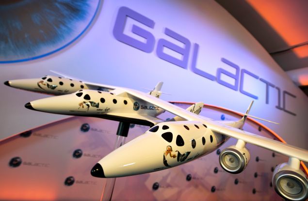 A model of the Virgin Galactic, the world?s first commercial spaceline, is displayed at the Farnborough International Airshow in Hampshire, southern England, on July 11, 2012. Virgin Galactic announced ?LauncherOne,? a new air-launched rocket specifically designed to deliver small satellites into orbit. Commercial flights of the new orbital launch vehicle are expected to begin by 2016, Virgin Galactic aims to offer frequent and dedicated launches at the world?s lowest prices. AFP PHOTO / ADRIAN DENNIS (Photo credit should read ADRIAN DENNIS/AFP/GettyImages)