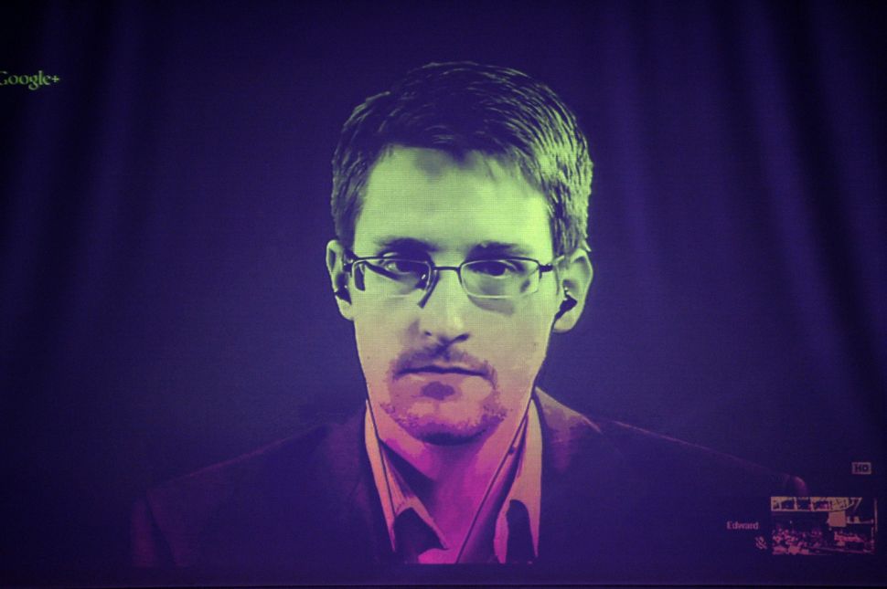 US National Security Agency (NSA) whistleblower Edward Snowden speaks to European officials via videoconference during a parliamentary hearing on improving the protection of whistleblowers, at the Council of Europe in Strasbourg, eastern France, on June 24, 2014. (Photo: FREDERICK FLORIN/AFP/Getty Images)