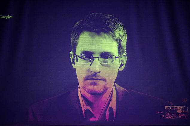 US National Security Agency (NSA) whistleblower Edward Snowden speaks to European officials via videoconference during a parliamentary hearing on improving the protection of whistleblowers, at the Council of Europe in Strasbourg, eastern France, on June 24, 2014. AFP PHOTO/FREDERICK FLORIN (Photo credit should read FREDERICK FLORIN/AFP/Getty Images)