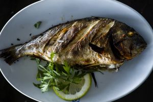 A picture shows a Sea Bream grilled with oil and lemon on the table at a restaurant in Cairo on October 23, 2014. AFP PHOTO/ KHALED DESOUKI (Photo credit should read KHALED DESOUKI/AFP/Getty Images)