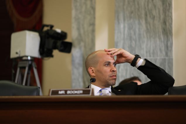 WASHINGTON, DC - JANUARY 15: Senate Commerce, Science and Transportation Committee member Sen. Cory Booker (D-NJ) listens to testimony during a hearing about the future of unmanned aviation in the Russell Senate Office Building on Capitol Hill January 15, 2014 in Washington, DC. The committee heard testimony about the Federal Aviation Administration's policy on unmanned aviation systems and about the privacy and freedom issues surrounding their use. (Photo by Chip Somodevilla/Getty Images)