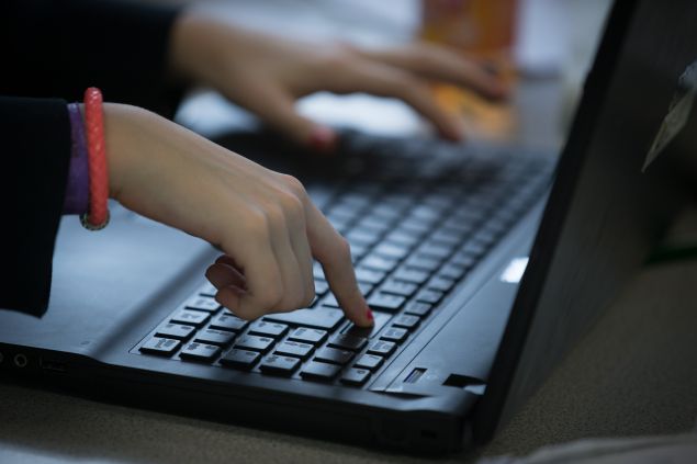 BRISTOL, UNITED KINGDOM - FEBRUARY 26: A pupil uses a laptop computer during a english lesson at the Ridings Federation Winterbourne International Academy in Winterbourne near Bristol on February 26, 2015 in South Gloucestershire, England. Education, along with National Health Service and the economy are likely to be key election issues in the forthcoming general election in May. (Photo by Matt Cardy/Getty Images)