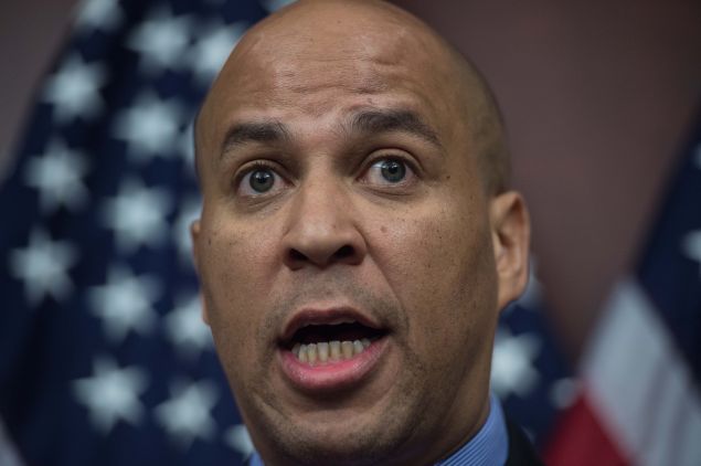 US Democratic Senator from New Jersey Cory Booker speaks at a press conference to announce new bipartisan legislation to allow patients, doctors and businesses in states that have already passed medical marijuana laws to participate in those programs without fear of federal prosecution.on Capitol Hill in Washington, DC, on March 10, 2015. AFP PHOTO/NICHOLAS KAMM (Photo credit should read NICHOLAS KAMM/AFP/Getty Images)