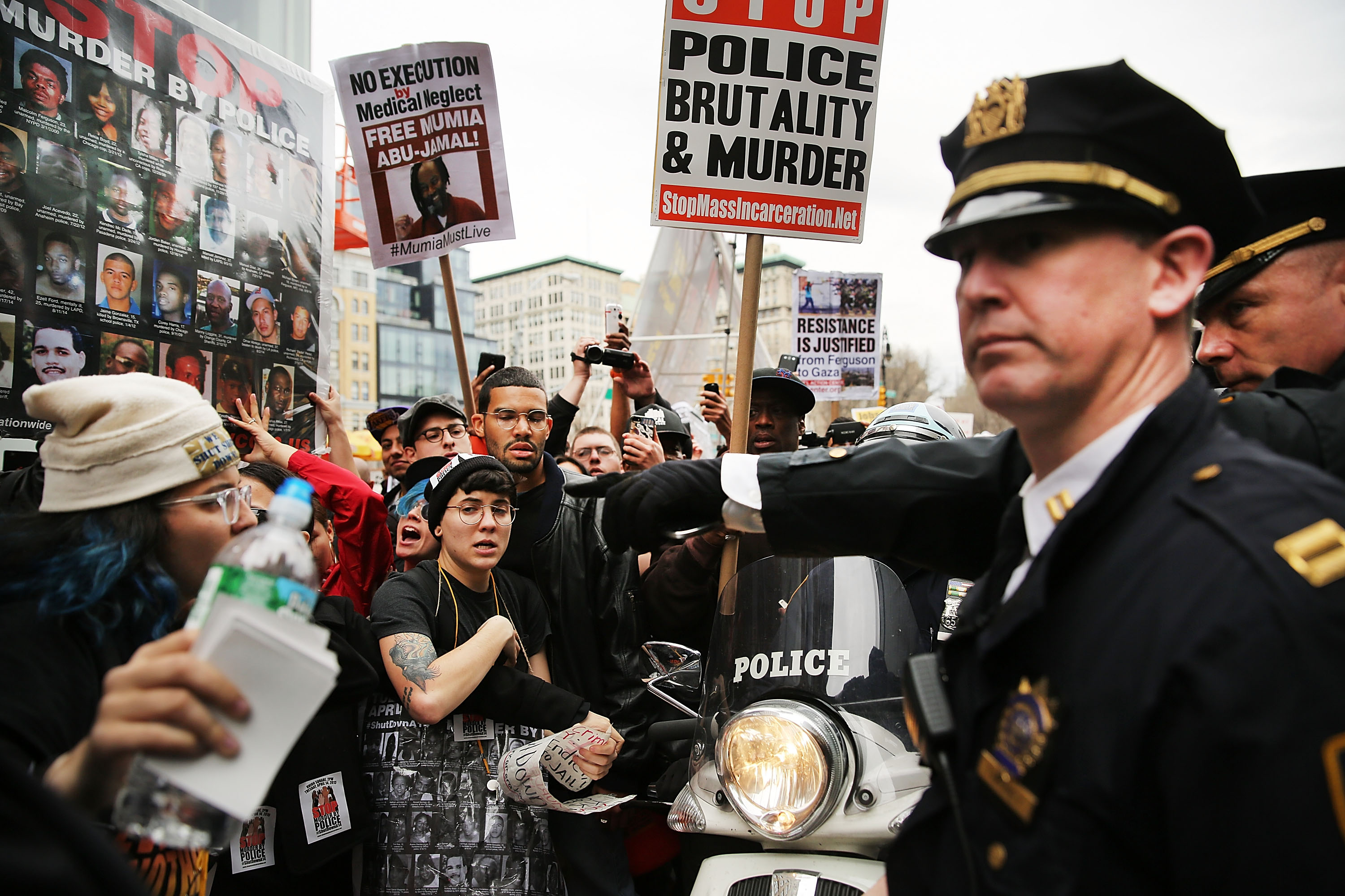 Protesters scuffle with police during a march against police violence in Manhattan on April 14, 2015 