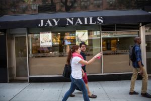 A nail salon in the Greenwich Village neighborhood of New York City. (Photo by Andrew Burton/Getty Images)