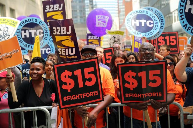 Labor leaders, workers and activists attend a rally for a $15 minimum hourly wage on July 22, 2015 in New York City.