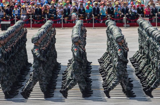 BEIJING, CHINA - SEPTEMBER 03: Chinese soldiers march in formation passed Tiananmen Square and the Forbidden City during a military parade on September 3, 2015 in Beijing, China. China is marking the 70th anniversary of the end of World War II and its role in defeating Japan with a new national holiday and a military parade in Beijing. (Photo by Kevin Frayer/Getty Images)