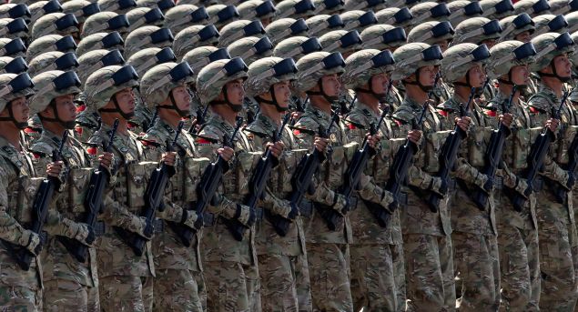 BEIJING, CHINA - SEPTEMBER 03: Chinese soldiers march in formation passed Tiananmen Square and the Forbidden City during a military parade on September 3, 2015 in Beijing, China. China is marking the 70th anniversary of the end of World War II and its role in defeating Japan with a new national holiday and a military parade in Beijing. (Photo by Kevin Frayer/Getty Images)