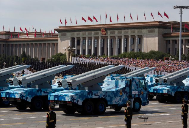 BEIJING, CHINA - SEPTEMBER 03: Chinese missiles are seen on trucks as they drive next to Tiananmen Square and the Great Hall of the People during a military parade on September 3, 2015 in Beijing, China. China is marking the 70th anniversary of the end of World War II and its role in defeating Japan with a new national holiday and a military parade in Beijing. (Photo by Kevin Frayer/Getty Images)