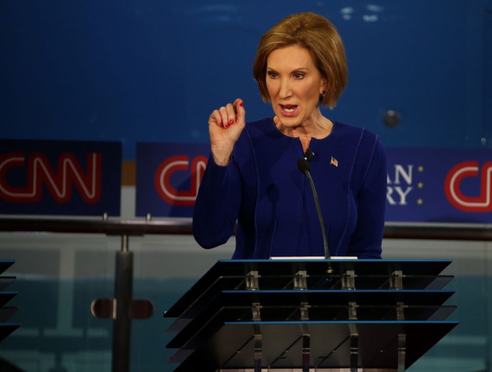 SIMI VALLEY, CA - SEPTEMBER 16: Republican presidential candidate Carly Fiorina take part in the presidential debates at the Reagan Library on September 16, 2015 in Simi Valley, California. Fifteen Republican presidential candidates are participating in the second set of Republican presidential debates. (Photo by Justin Sullivan/Getty Images)