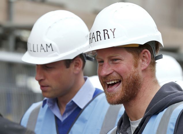 The princes could make hard hats a fashion trend. (Photo: PHIL NOBLE/AFP/Getty Images)